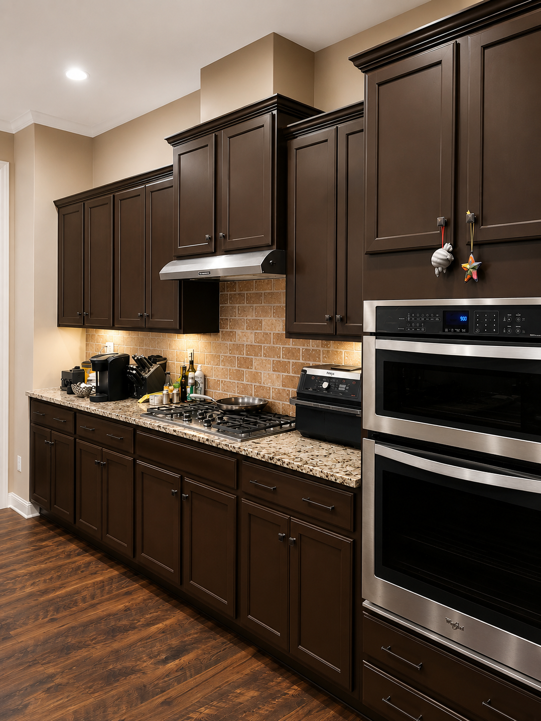 Before cabinet refinishing in Mint Hill kitchen with dark stained cabinets and existing countertops