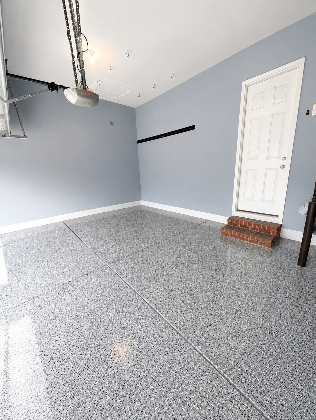 After photo of finished epoxy garage floor coating installation in Waxhaw NC with decorative flakes