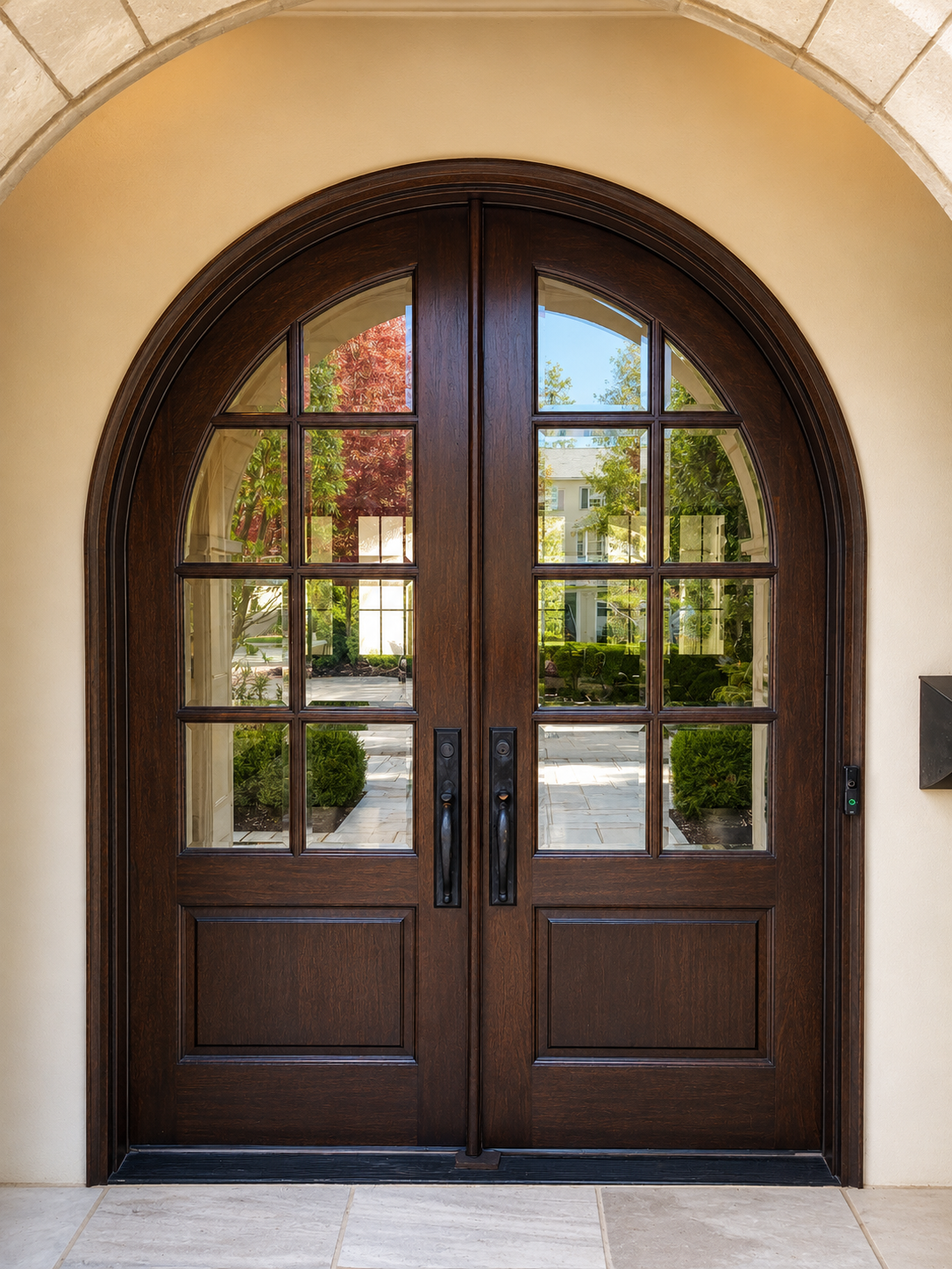 After photo of refinished arched front entry doors in South Charlotte with rich warm wood tone