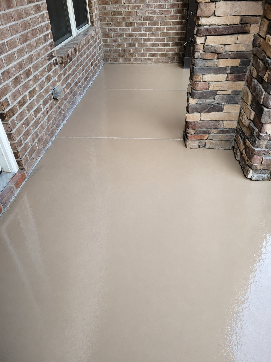Before photo of plain concrete porch flooring in Ballantyne Charlotte prior to decorative coating