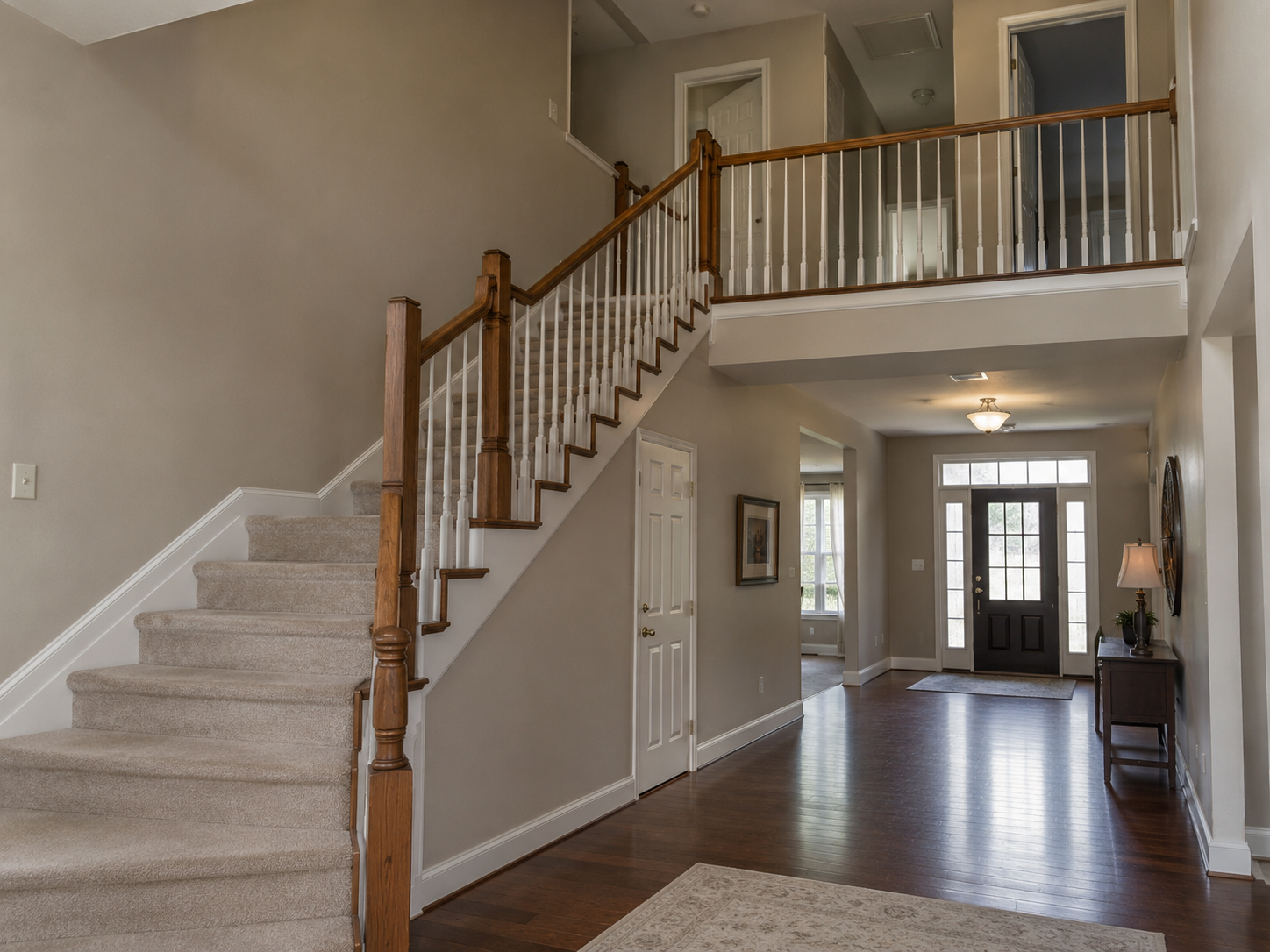 Before staircase renovation with carpeted treads and white balusters in Ballantyne Charlotte NC
