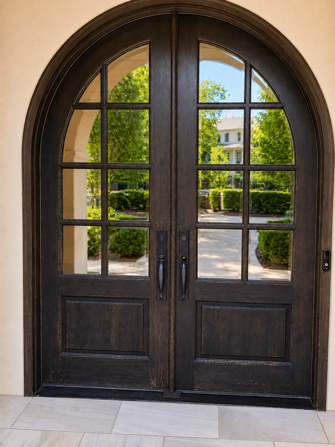 Before photo of arched front entry doors in South Charlotte with darker weathered finish