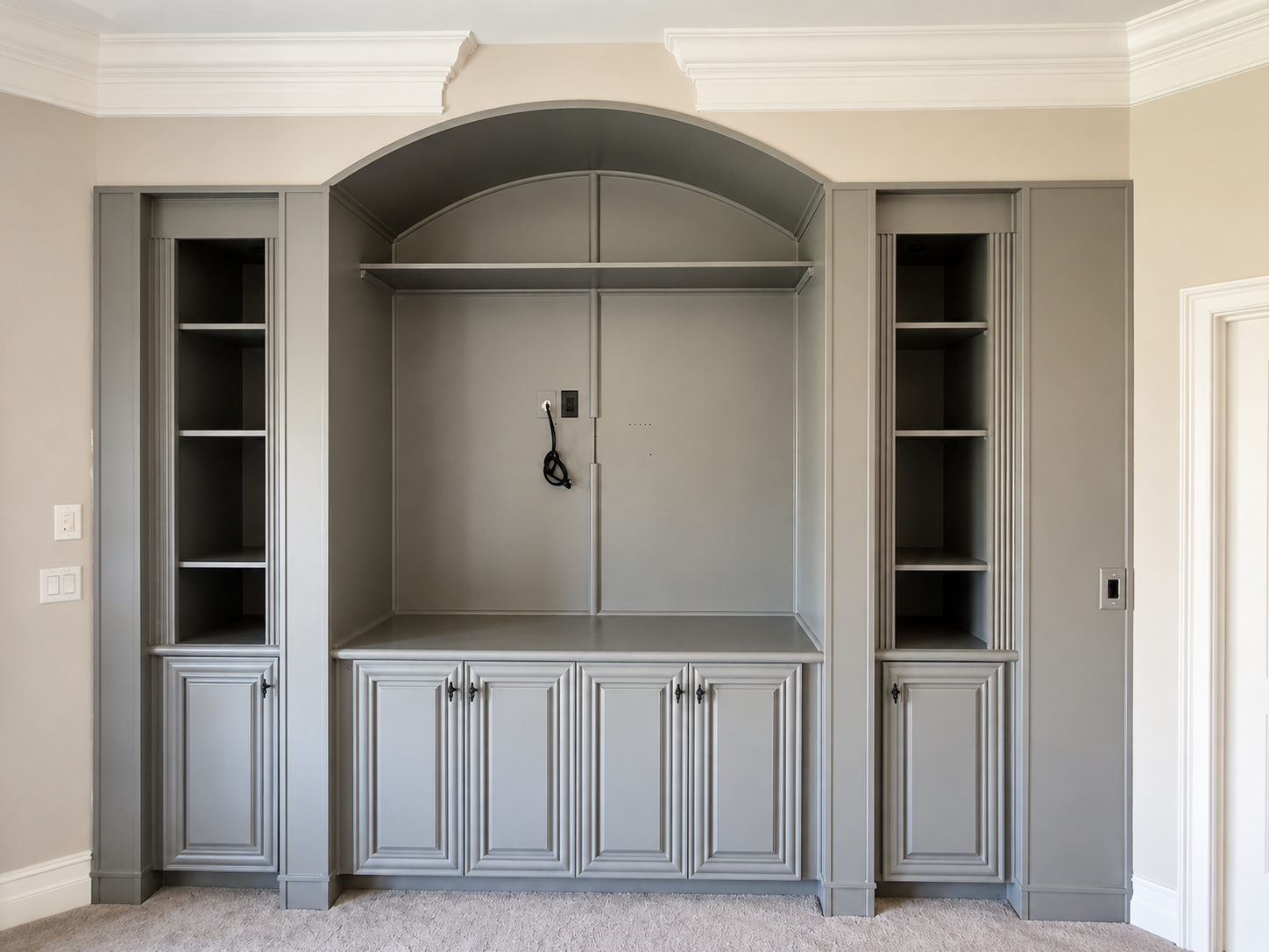 After interior painting photo of a Ballantyne NC built-in cabinet wall refinished in a custom warm gray