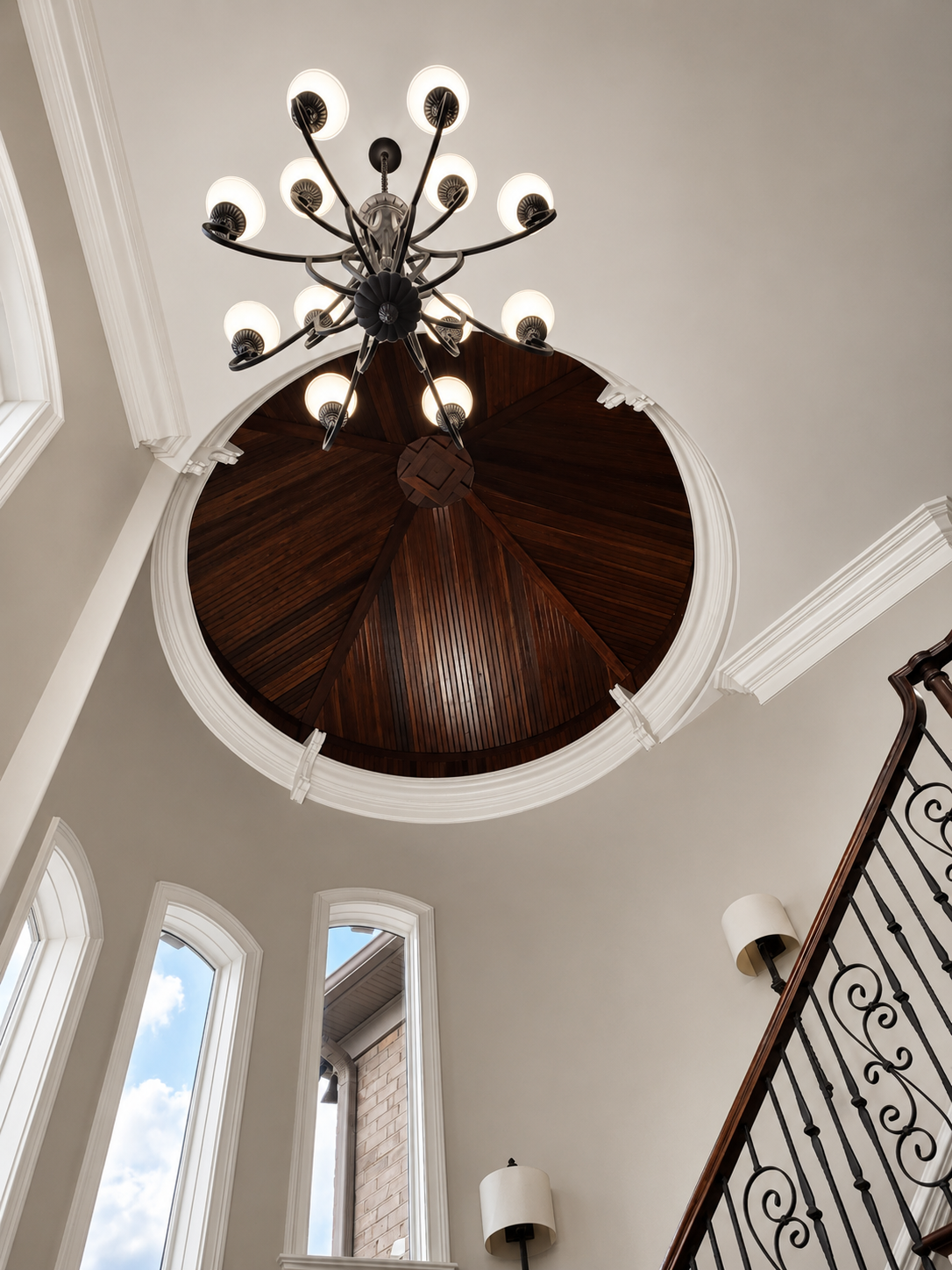 Before image of dark wood circular foyer ceiling with chandelier in Marvin NC